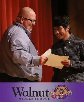  Student is inducted into Walnut's National Junior Honor Society.